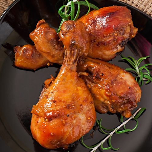 Baked chicken drumsticks in honey-mustard marinade